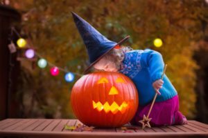 Little girl in a witch costume.